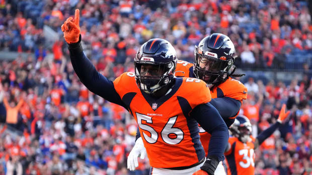 Denver Broncos inside linebacker Baron Browning (56) reacts to his tipped pass in the first quarter against the Los Angeles Chargers at Empower Field at Mile High.